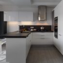 interior view of a modern kitchen with fresh fruit on the worktop near at sink