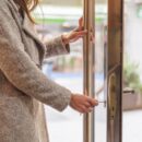 Unrecognizable woman opening portal door